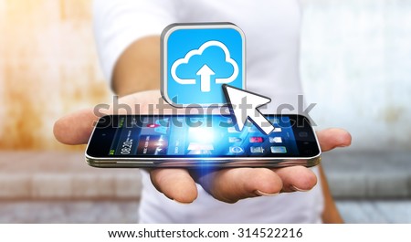 Businessman with modern mobile phone uploading image in his cloud