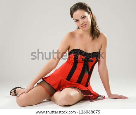young woman in red short dress