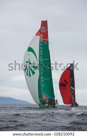 GALWAY, IRELAND - JULY 7: PUMA Ocean Racing  and Groupama Sailing Team, passing the mark in the Discover Ireland In-Port Race, during the Volvo Ocean Race 2011-12, on July 7, 2012 in Galway, Ireland.
