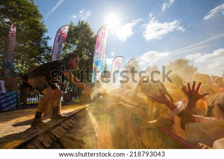 LOUGH CUTRA, GORT, IRELAND - SEPTEMBER 6: Unidentified people having fun and get showered in powdered dye during  annual RUN OR DYE, the 5K event, on September 6, 2014 in Lough Cutra, Gort, Ireland.