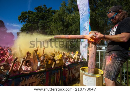 LOUGH CUTRA, GORT, IRELAND - SEPTEMBER 6: Unidentified people having fun and get showered in powdered dye during  annual RUN OR DYE, the 5K event, on September 6, 2014 in Lough Cutra, Gort, Ireland.