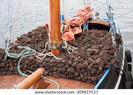 Traditional wooden boat Galway Hooker, loaded with turf.