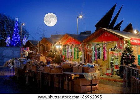 Continental Christmas Market in Eyre Square, Galway, at night time and full moon