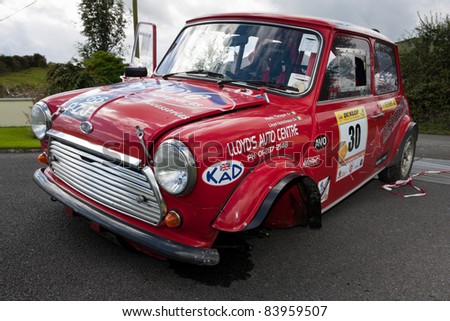LOUGHREA - AUGUST 28: Damaged red Austin Mini Cooper S after accident  at  annual Galway Summer Rally  on August 28, 2011 in Loughrea, Ireland