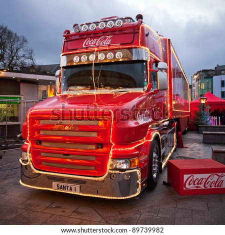 GALWAY - NOVEMBER 27: Coca-Cola iconic Christmas truck at \'Holidays are coming\' advert at Annual Galway Continental Christmas Market  on November 27, 2011 in Galway, Ireland.