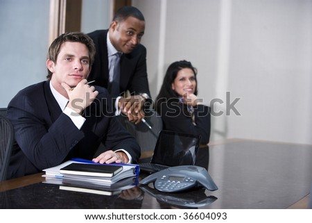 Multi-ethnic business executives meeting in boardroom