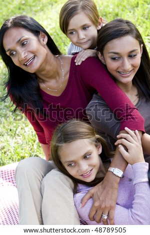 Indian mother with three beautiful mixed-race children