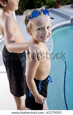 Boys, 7 And 9, Standing Beside Swimming Pool Stock Photo 65179093 ...