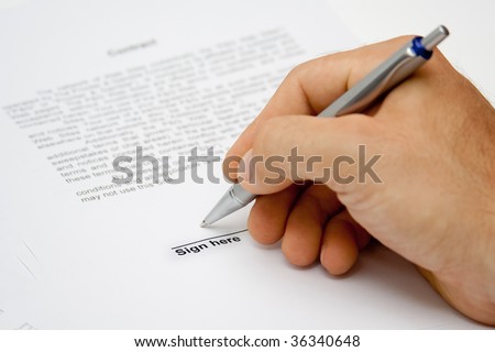 Man hand signing paper