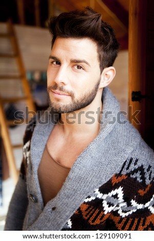 Portrait of a young man in a cabin