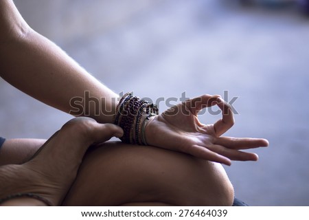 Young woman meditating indoors