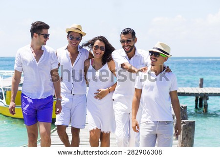 Group of young people traveling in latin-america. Isla Mujeres, Mexico.