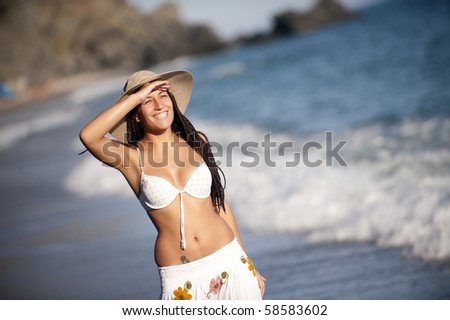 Young tanned girl looking to the horizon