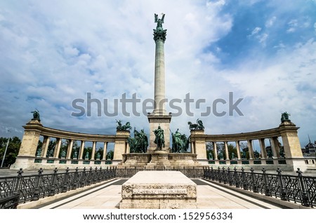 Corinthian column topped with Archangel Gabriel holding St. Stephen\'s crown.At the base: Arpad and the chieftains of the seven Magyar tribes. Behind the column: kings and heroes from Hungarian history
