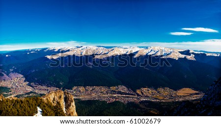 Busteni landscape, with Baiului mountains in background. Busteni is a small mountain town in the north of the county Prahova, in the center of Romania located in the Prahova Valley