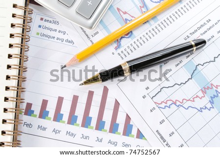Background of business graph with pen and calculator