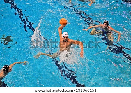 TURIN - MARCH 16: Shooting of unidentified player of Torino81 team during the water polo match between Torino81 and Lavagna90, on March 16, 2013 Turin, Italy.