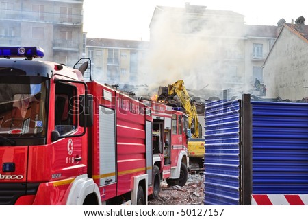 TURIN - APRIL 2: Firemen to put out a fire of a senior social centre in Pozzo Strada neighborhood. April 2, 2010 in Turin, Italy.