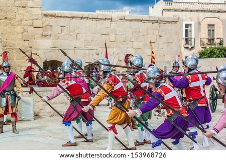 BIRGU, MALTA - NOV 04: In Guardia re-enactment portraying the inspection of the fort and its garrison by the Grand Bailiff of the Order of the Knights of St. John on November 04, 2012 in Birgu, Malta.