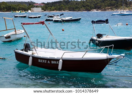 Rent motor boat for summer vacation trip to exotic tropical islands.Rental yachts drifting in beautiful blue sea.Beautiful travel destination on Adriatic Sea.Crystal clear water.Rent water craft boat