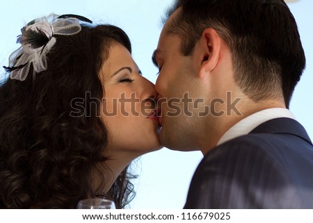 First sweet kiss after the wedding toast
