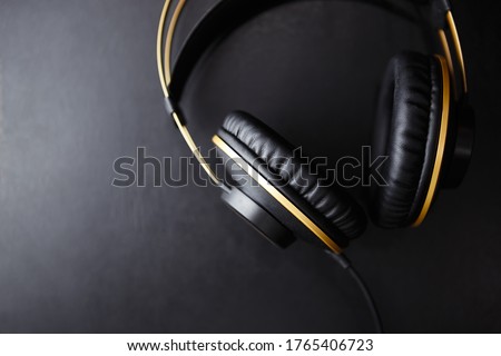 Listen to musical tracks with professional headphones.Big black stereo headset with hifi sound for audiophile and sound enthusiast.Enjoy listening to new music in high quality with head monitors