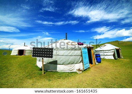 Mongolian ger camps with solar power, TV satellite and oxcart, Central Mongolia. Great contrast, modern and traditional lifestyle melting each other