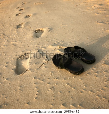 Footsteps and Sandal on sand