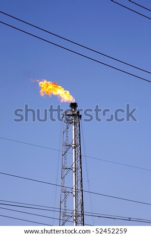 gas oil flare and power line wires