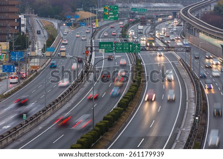SUITA, JAPAN - MARCH 15, 2015: Chugoku Expressway at dusk, one of the busiest highways in Japan. It connects Kansai and Chugoku including major cities of Hiroshima, Kobe, and Osaka.