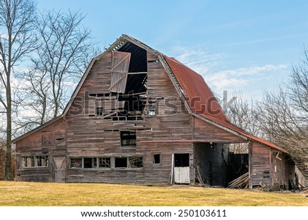 An old barn in rural Indiana is slowly falling down.