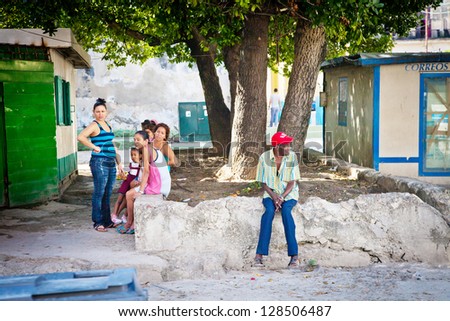 HAVANA-DECEMBER 30: Cuban native people on streets of Havana 30, 2012 in Cuba. Cuba is home to over 11 million people and is the most populous island nation in the Caribbean