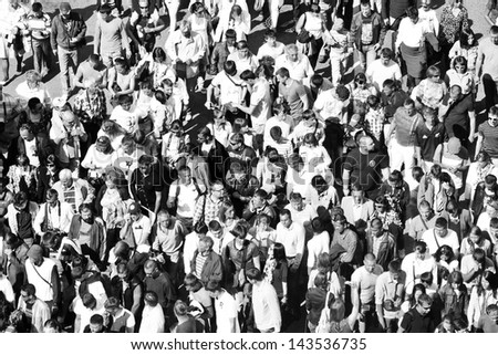 MOSCOW - MAY 09: Crowd on Moscow street during 65th anniversary of Victory Day on May 9, 2013 in Moscow, Russia. In monochrome.