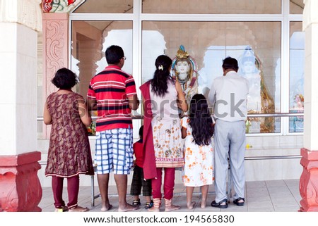 MAURITIUS-DECEMBER 29: Group of people praying at Grand Bassin temple on December 29, 2014 in Mauritius. It is considered the most sacred Hindu place in Mauritius.