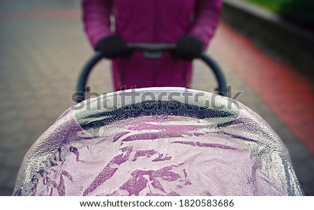 Similar – Image, Stock Photo Stroller in the rain with umbrella