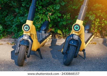 Similar – Image, Stock Photo Parking space for e-scooters and bicycles