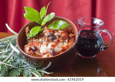 Cod with olives and a jug of wine