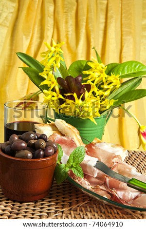 Typical Italian sausage sliced  and flowers