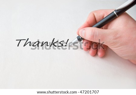 Thanks with hand and black pen over white