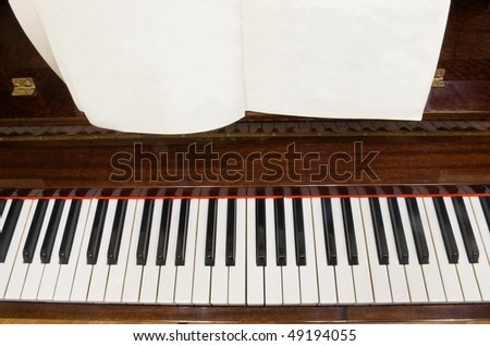 piano keys with blank/empty notes paper