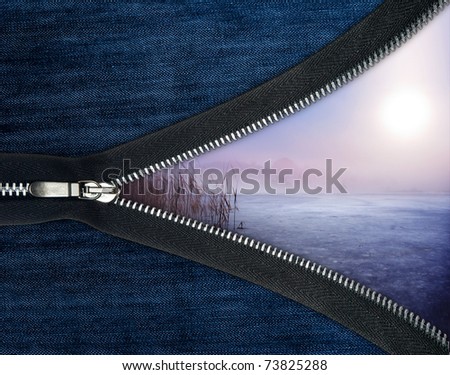 Concept of starting a new day. Zipper over blue jeans and winter landscape