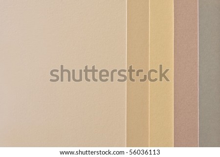 Samples of paper in various neutral colors with room for text