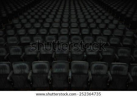 Seats in dark cinema room