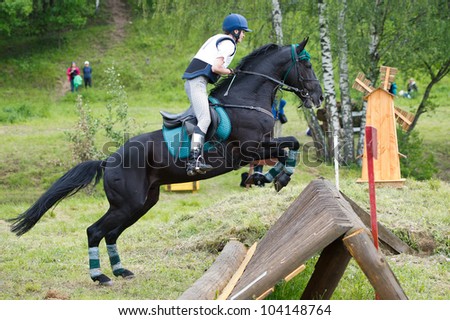 MOSCOW - JUNE 02: Unidentified rider on horse overcomes the obstacle at the International Eventing Competition CCI3*/2*/1* Russian Cup Eventing June 02, 2012 in Moscow, Russia