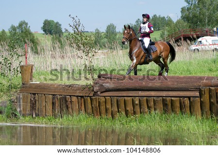 MOSCOW - JUNE 02: Unidentified rider on horse overcomes the obstacle at the International Eventing Competition CCI3*/2*/1* Russian Cup Eventing June 02, 2012 in Moscow, Russia