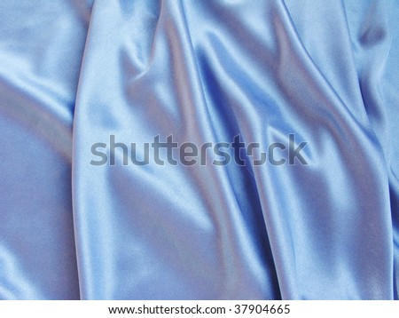 shiny satin blue material as background