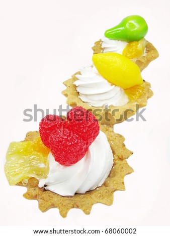 group of fancy cakes with marmalade fruits
