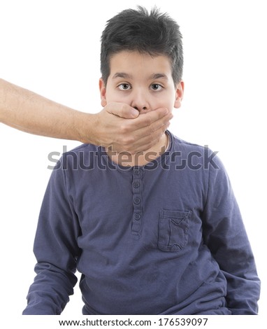 Male hand shuts up cute boy isolated on white background