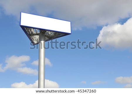 Outdoor advertisement with big blank billboard over blue sky. Put your own text here