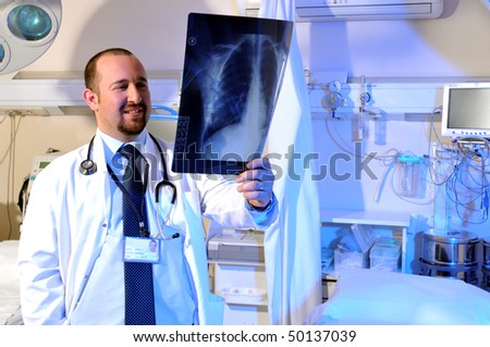 Medical doctor looking at x-ray - a series of emergency room photos.
